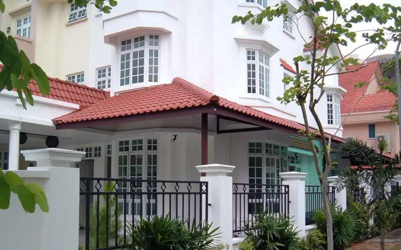 Roofing supplier installing roof tiles on a residential house in Singapore